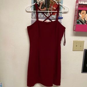 A Red Cross strapped dress. Never worn!! NWOT!! Length ends at knees!!